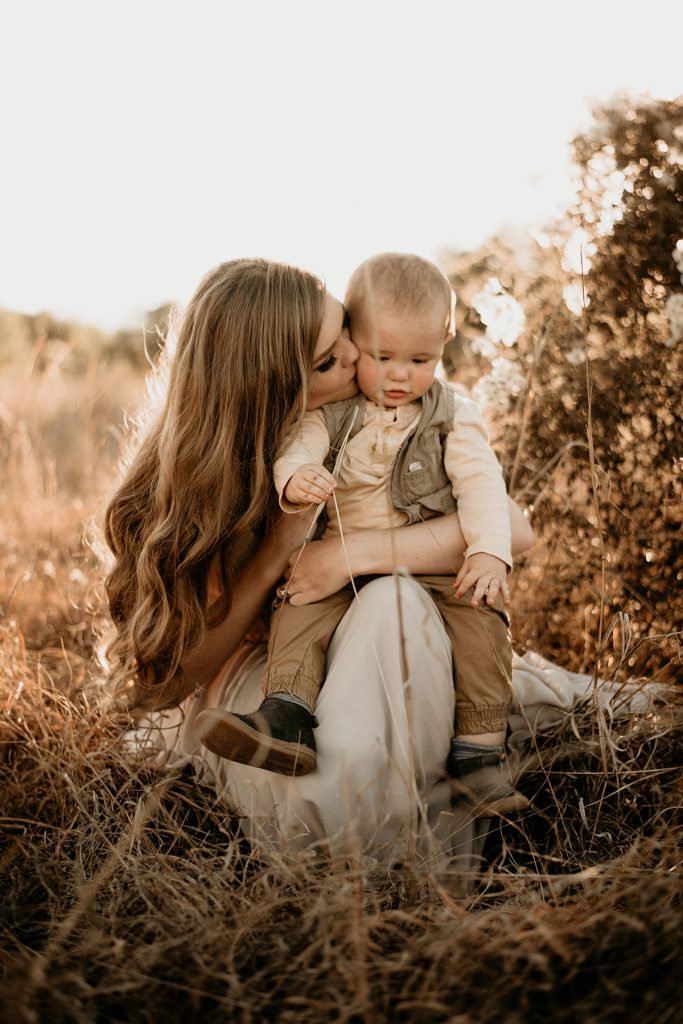 Mom kissing her Boy