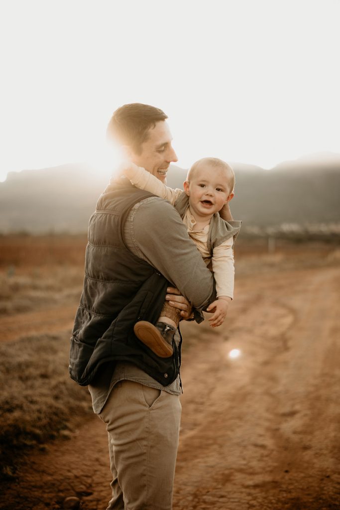 Father hugging his son at The Nut Farm Venue by Echo Photography