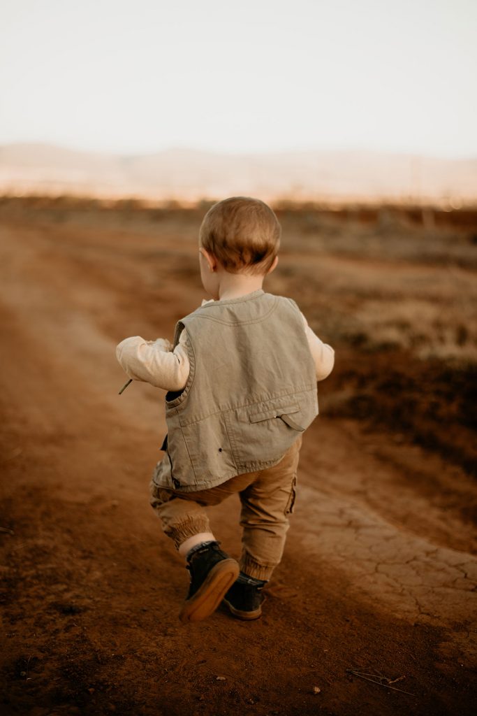 Boy running down the road at The Nut Farm Venue by Echo Photography