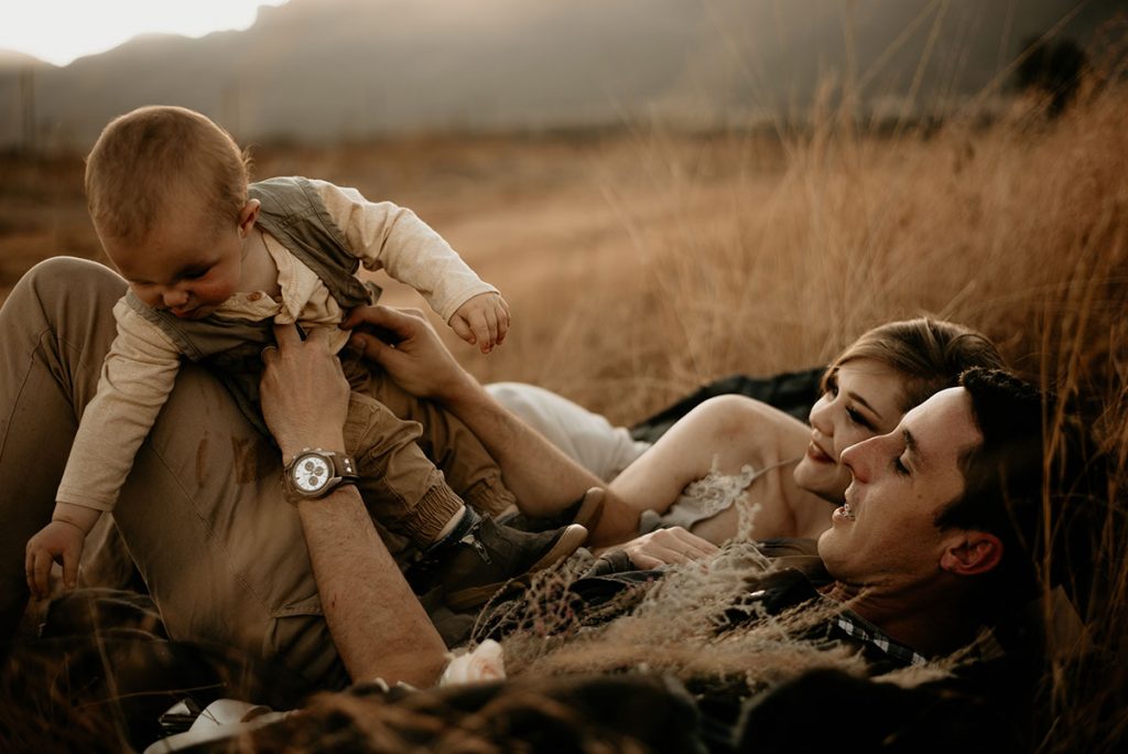Family in a field at The Nut Farm Venue by Echo Photography
