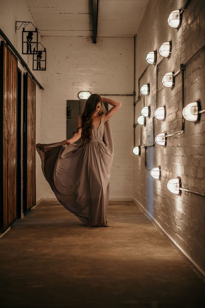 Flowing dress in Industrial setting at The Nut Farm Venue by Echo Photography