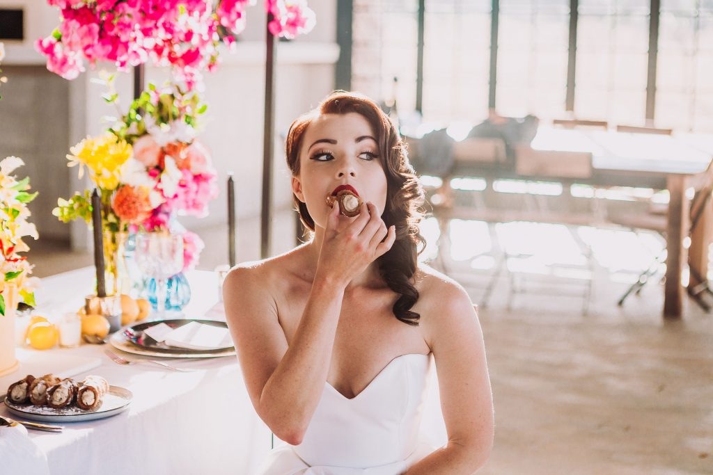 Bride enjoying cannoli