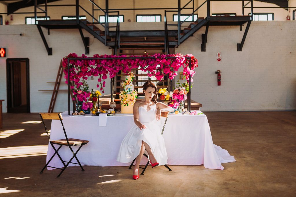 bride at elevated bougainvillea table decor runner