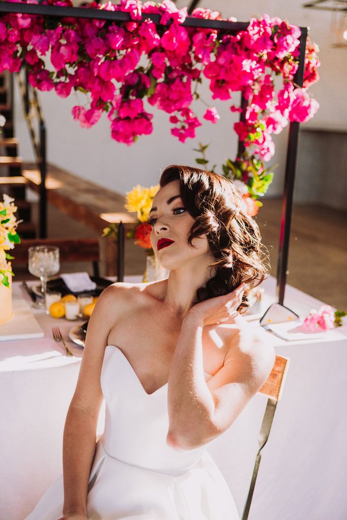 bride at elevated bougainvillea table decor runner